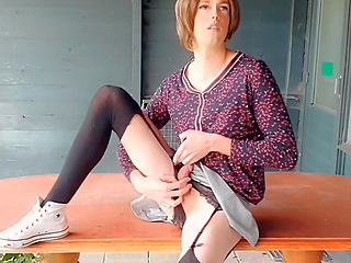 Annemieke playing in front of abandoned restaurant